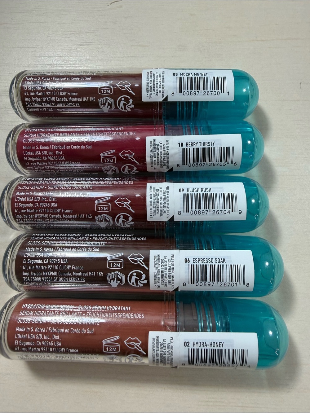 NYX Lip I.V. Hydrating Gloss Serum Set - Teal Caps with Berry, Red & Nude Shades - Picture 3 of 3